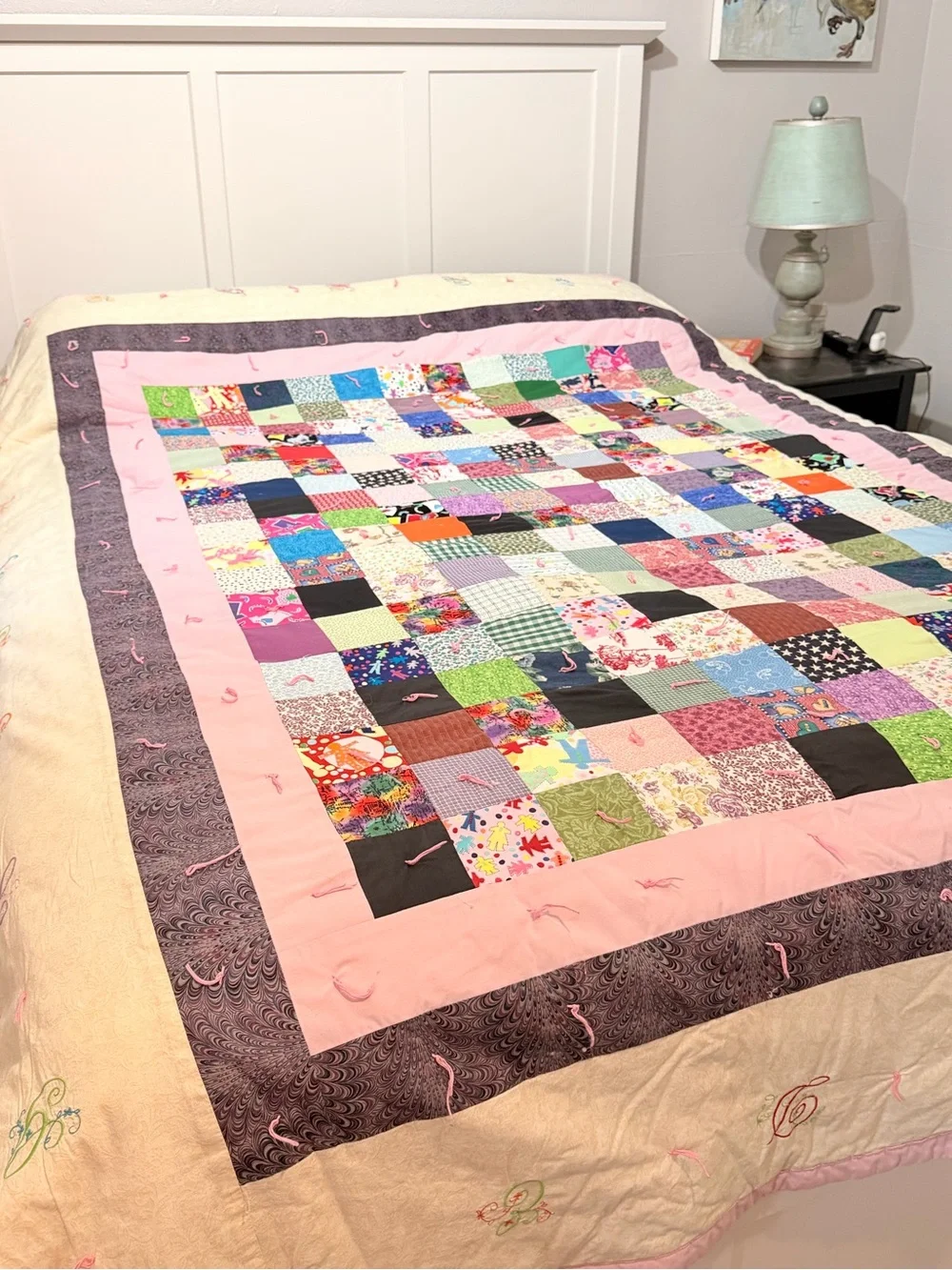 Hand crafted patchwork quilt with tan border